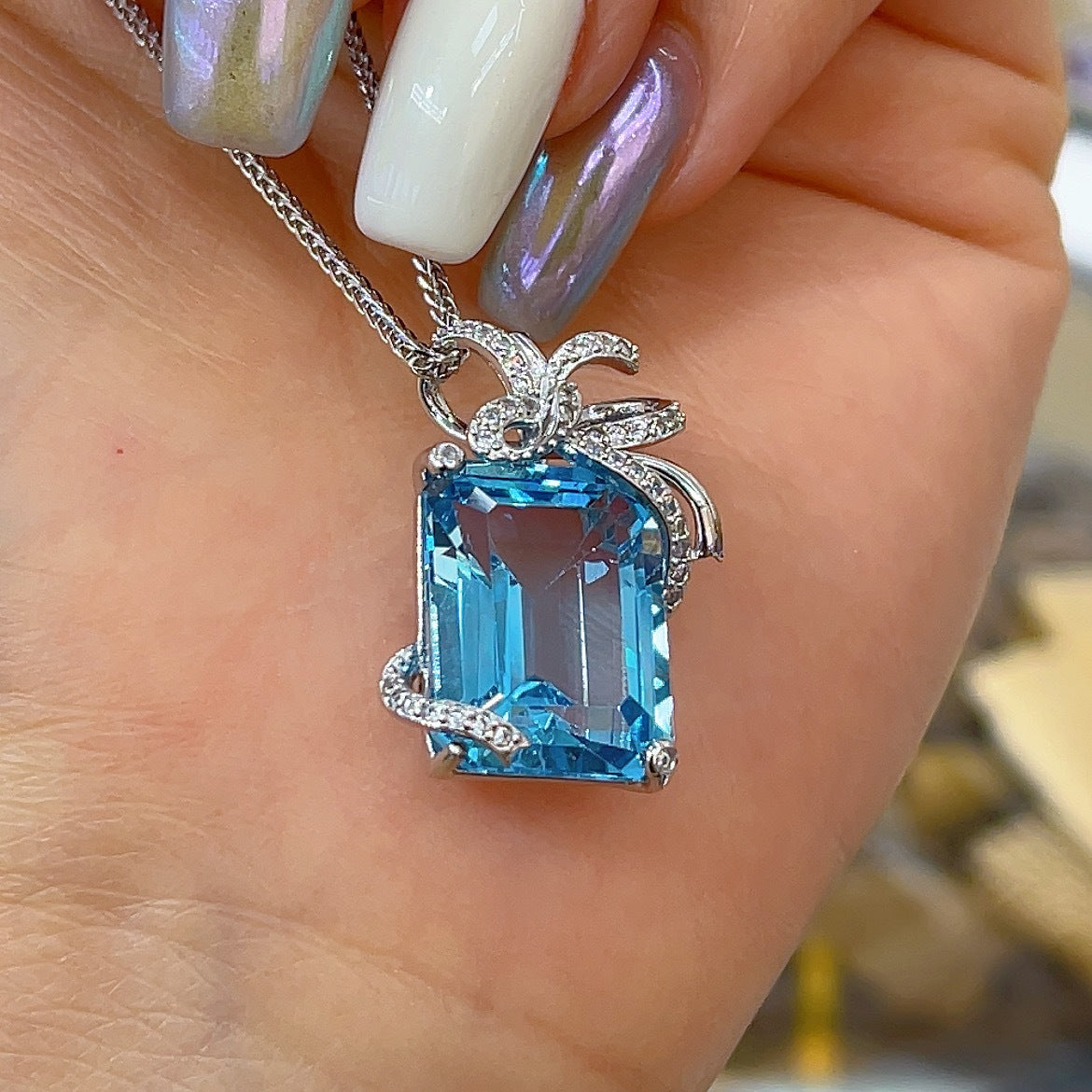 Elegant Rhodium Plated 925 Sterling Silver Natural Sky Blue Topaz Bow Pendant