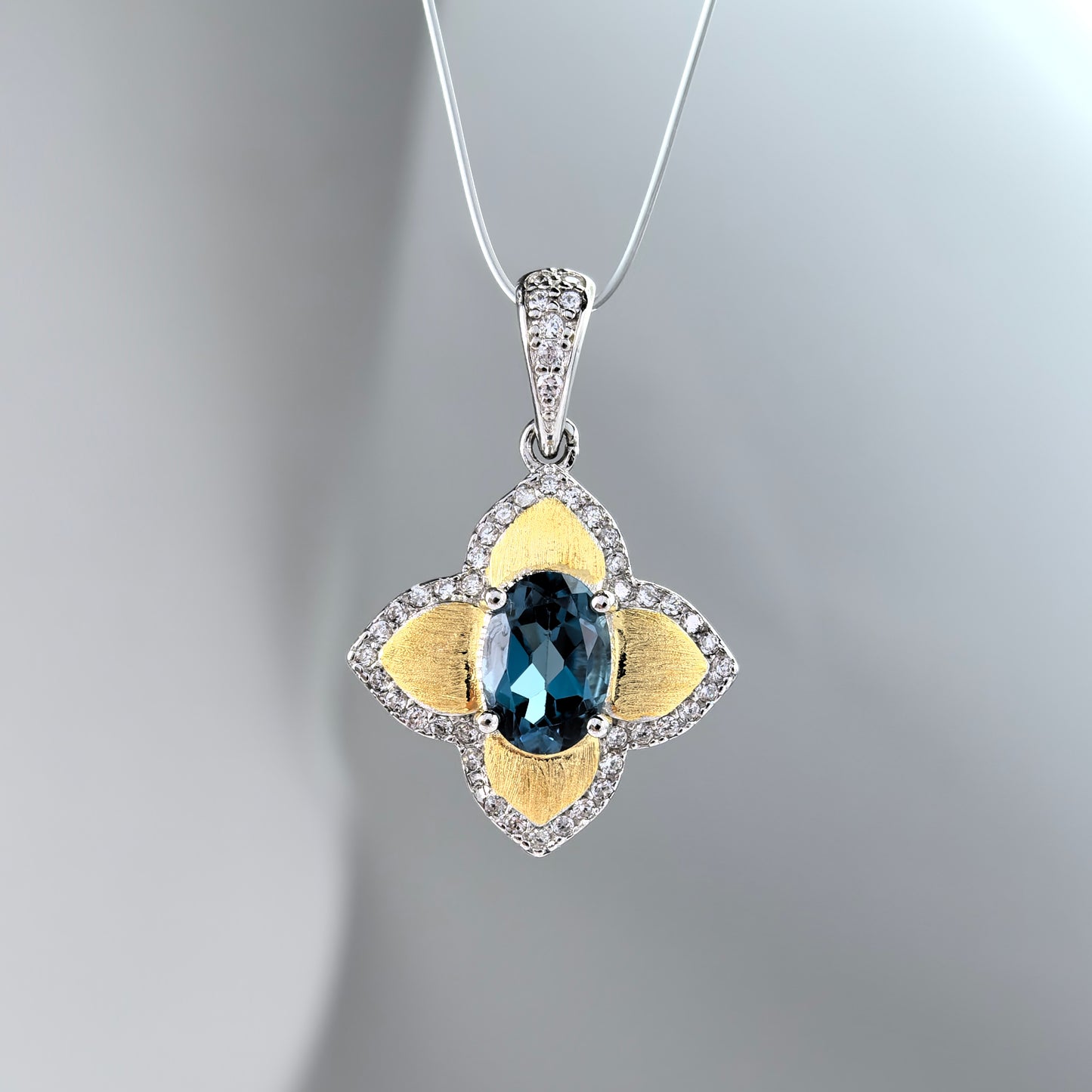 Elegant Rhodium and Gold Plated 925 Sterling Silver Natural London Blue Topaz Pendant