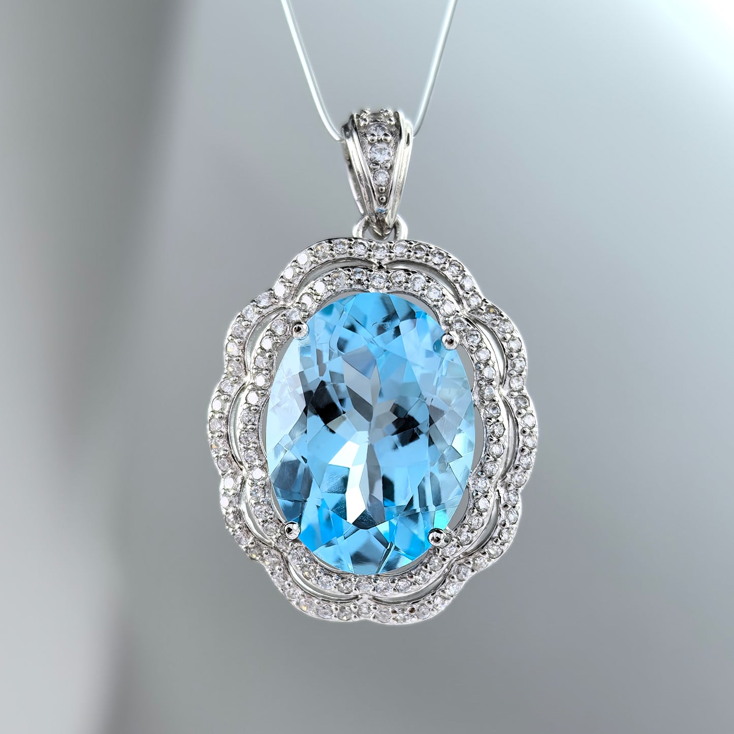Gorgeous Rhodium Plated 925 Silver Natural Sky Blue Topaz Flower Pendant