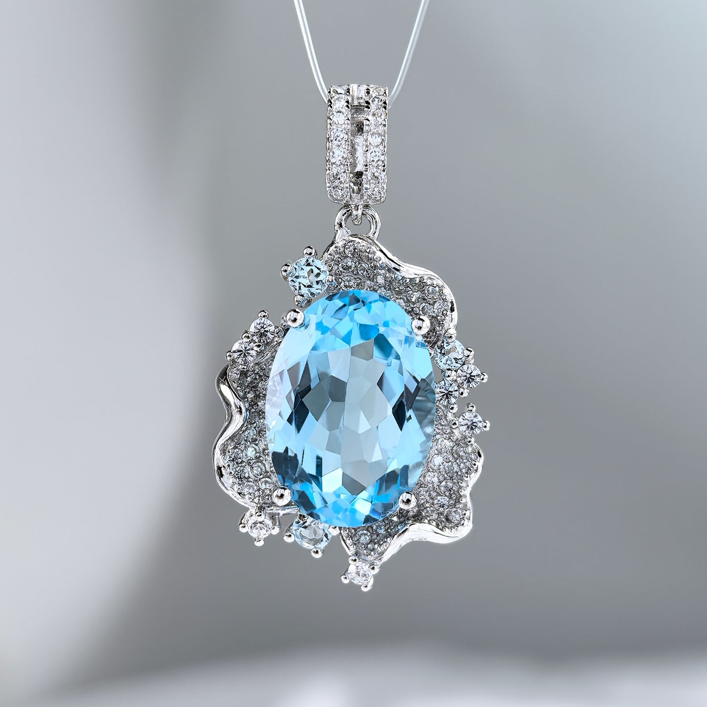 Graceful 925 Sterling Silver Pendant Rhodium Plated with Natural Sky Blue Topaz