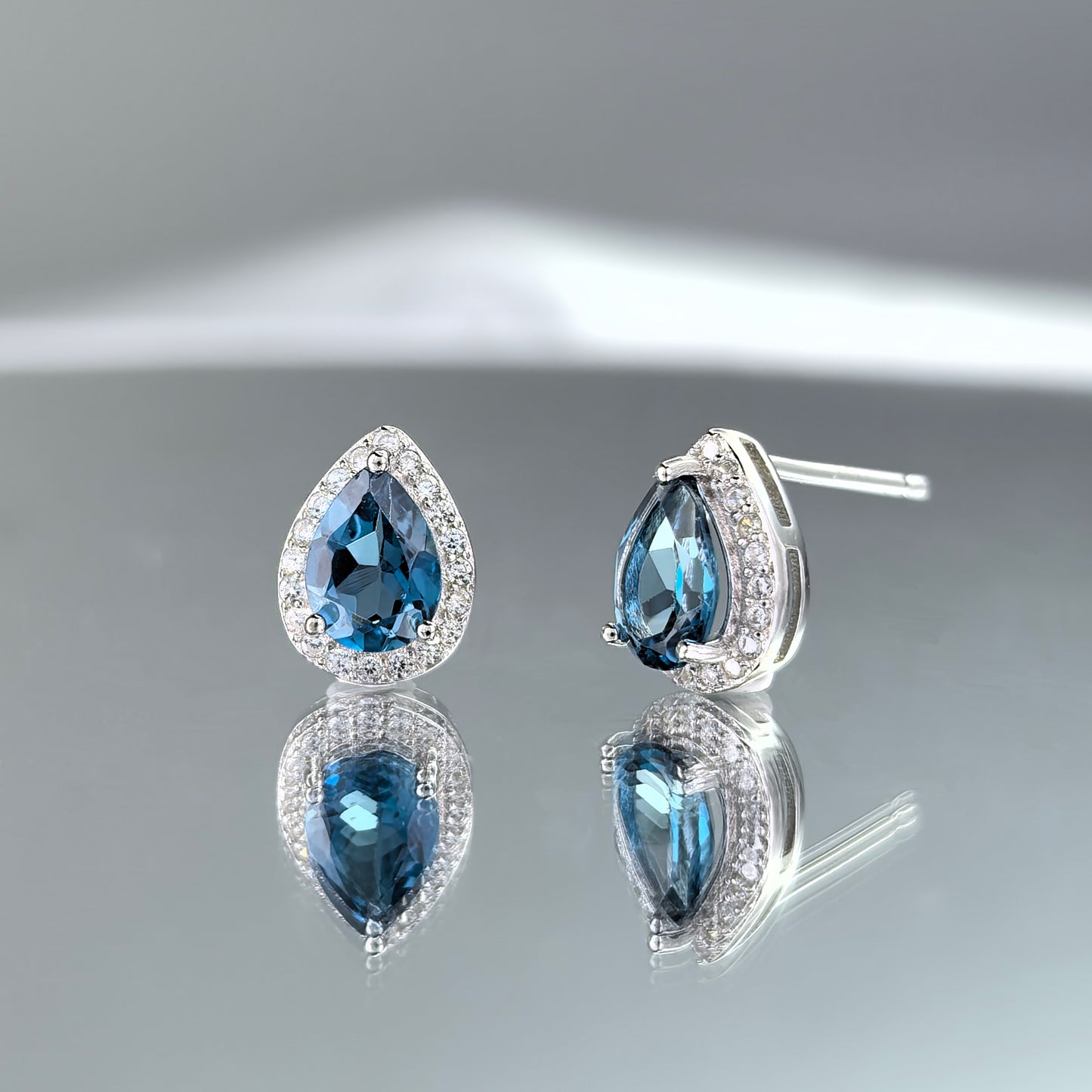 925 Silver Sparkling Rhodium Plated Natural London Blue Topaz Stud Earrings