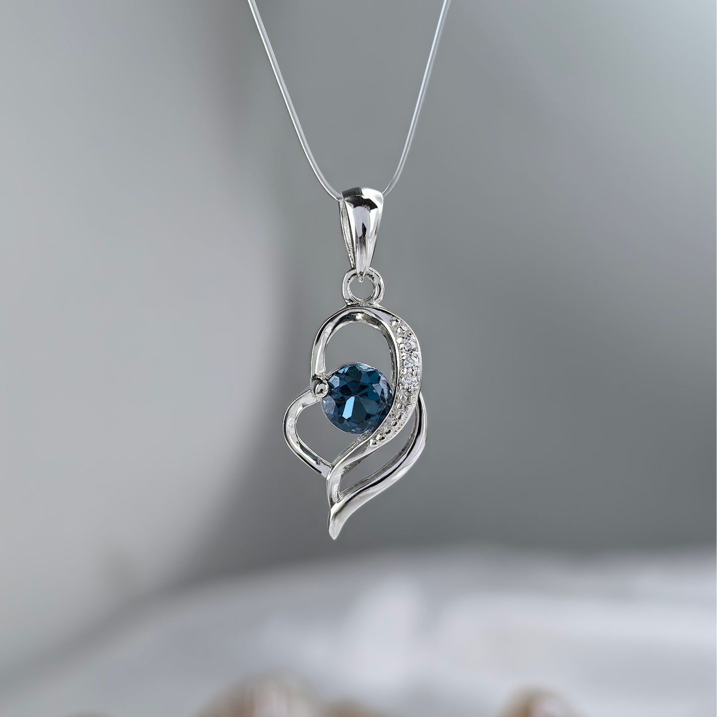 Charming Rhodium Plated Silver 925 Natural London Blue Topaz Heart Pendant
