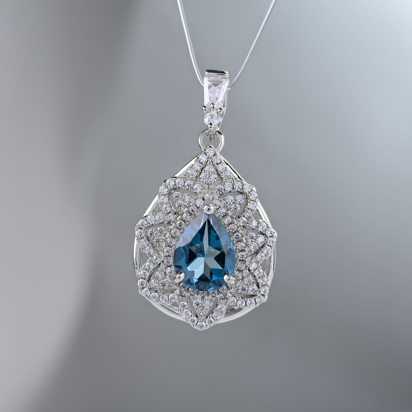 Graceful Rhodium Plated 925 Silver Natural London Blue Topaz Pendant