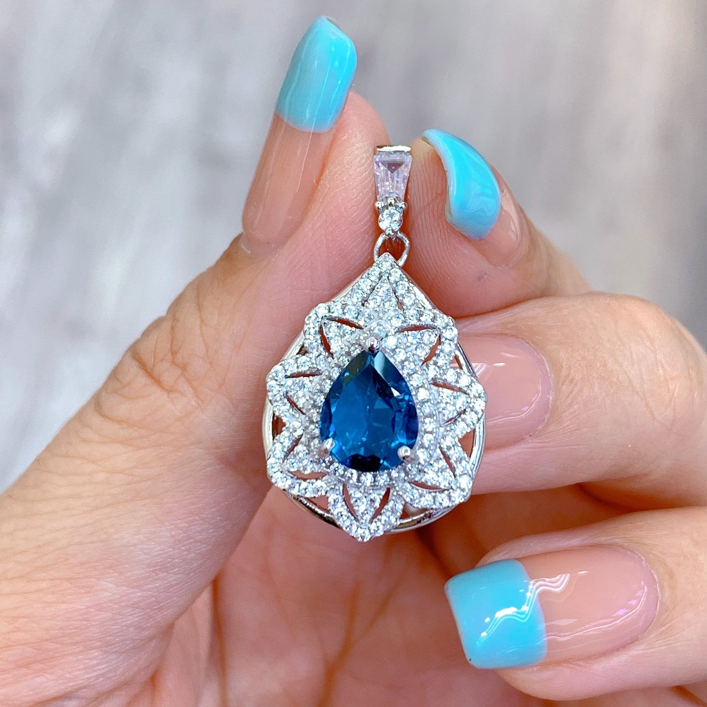 Graceful Rhodium Plated 925 Silver Natural London Blue Topaz Pendant