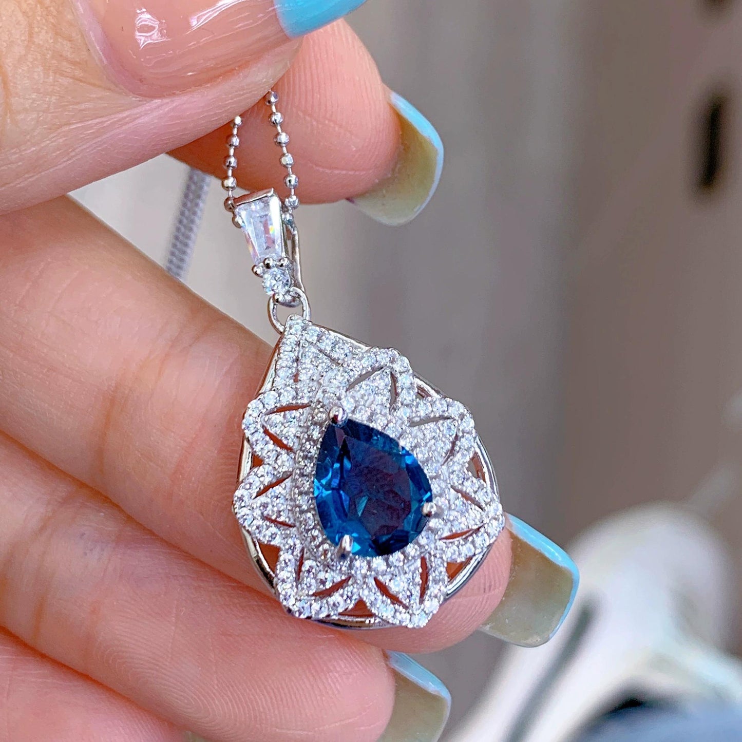 Graceful Rhodium Plated 925 Silver Natural London Blue Topaz Pendant