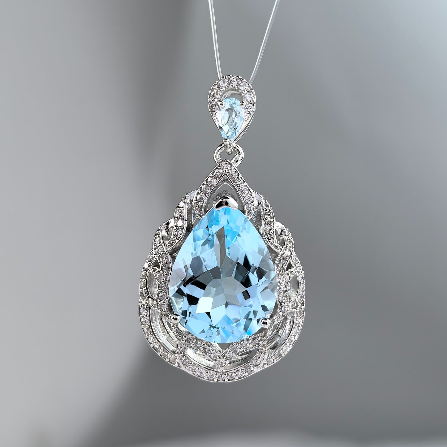 Charming Rhodium Plated 925 Sterling Silver Natural Sky Blue Topaz Pendant