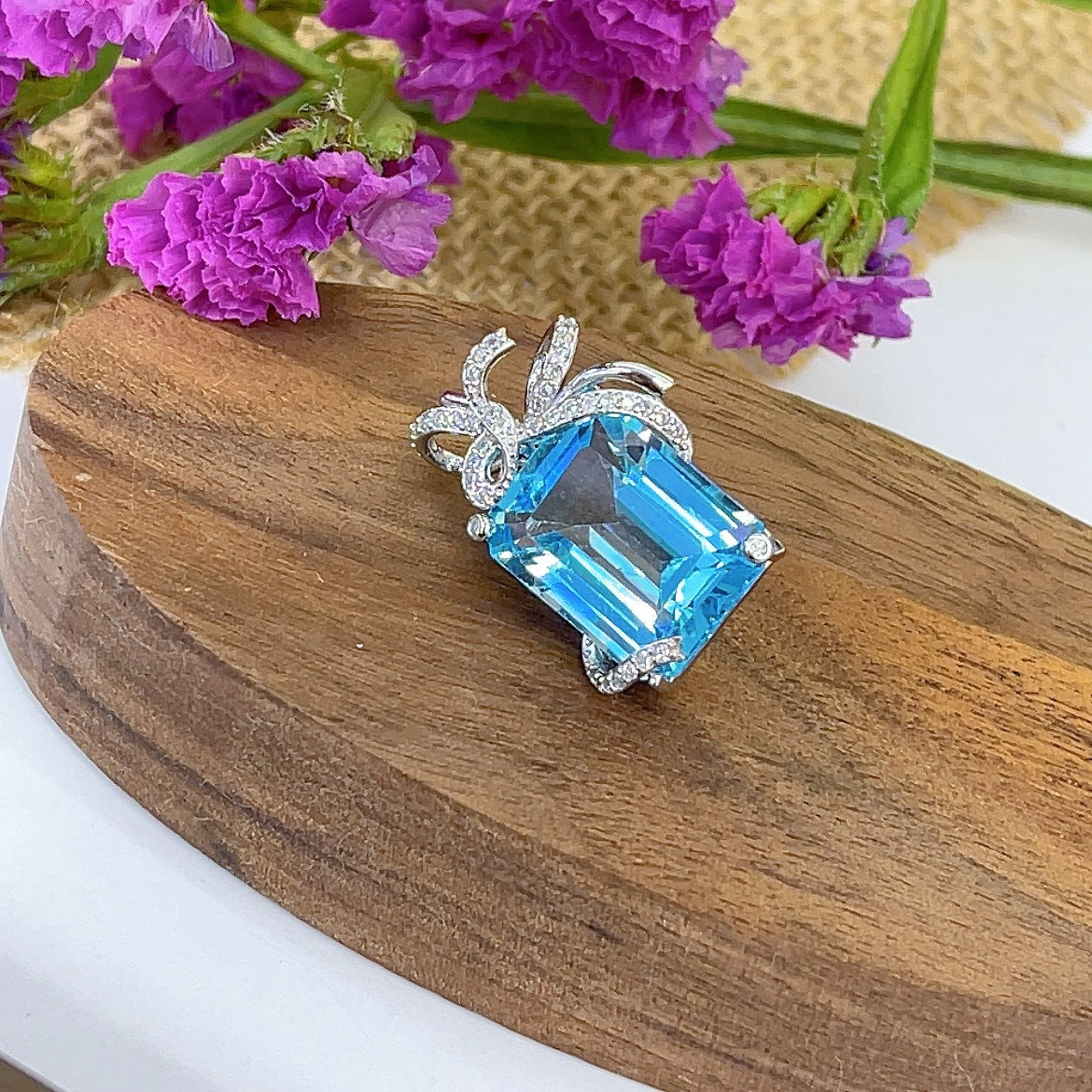 Elegant Rhodium Plated 925 Sterling Silver Natural Sky Blue Topaz Bow Pendant