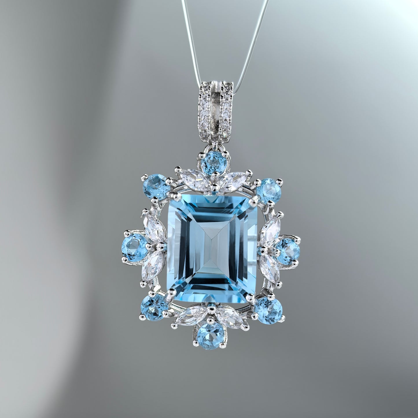 Delicate Rhodium Plated 925 Silver Emerald Cut Natural Sky Blue Topaz Pendant